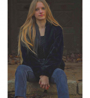hair, hand, jacket, outerwear, jeans, denim, sitting
